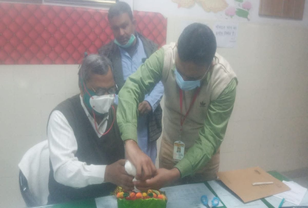 Priests applying ointment after bandaging Laddu Gopal hand in Agra