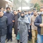 Mehbooba Mufti with workers in Kupwara.