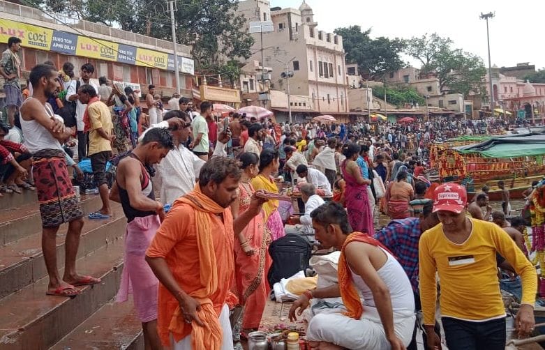 Devotees gathered on the Mandakini coast