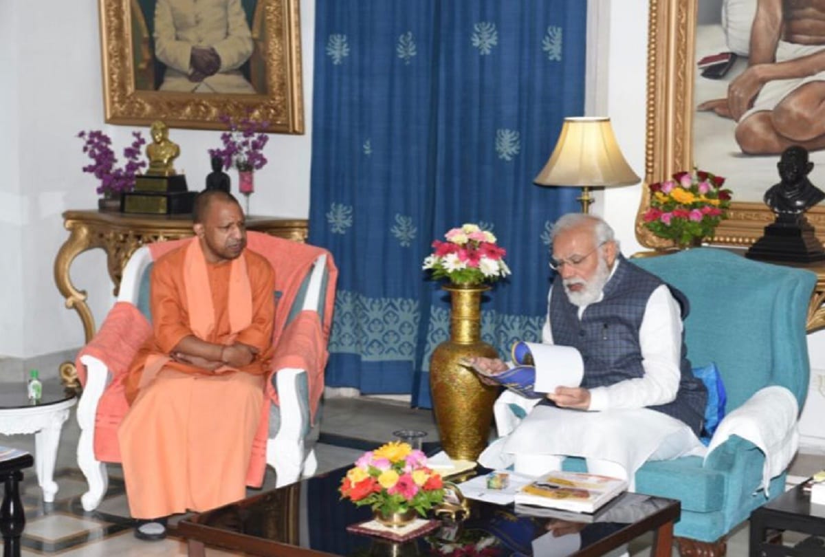 Yogi Adityanath meets Prime Minister Narendra Modi at Raj Bhavan