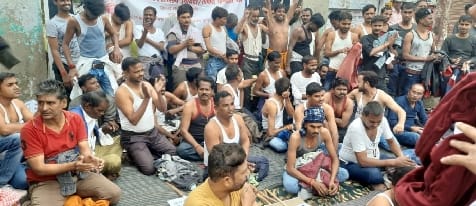Contract and tender electricity workers performed half-naked