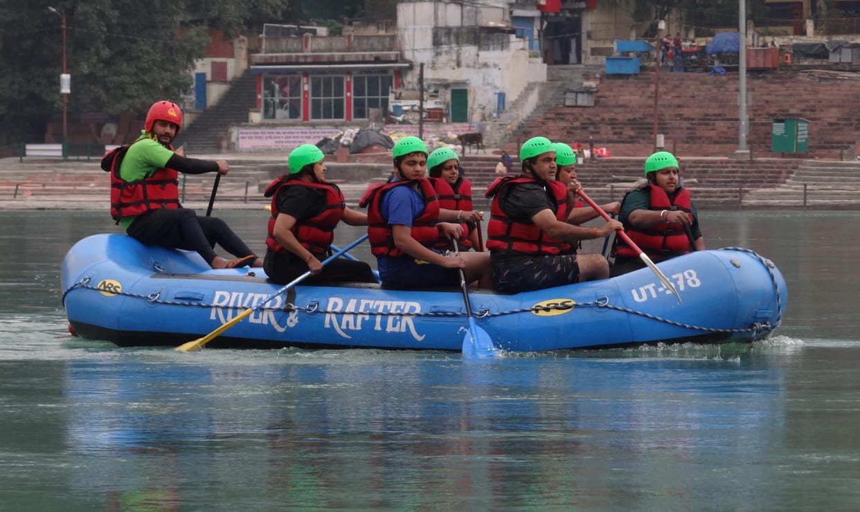 Tourists enjoy river rafting