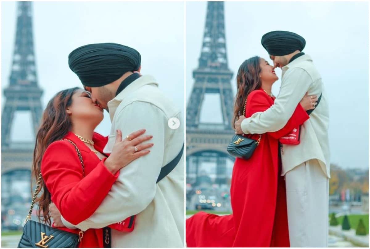 Neha Kakkar kisses husband Rohanpreet Singh in front of Eiffel Tower.