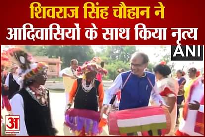 Madhya Pradesh CM Shivraj Singh Chauhan plays dhol, dances with the people from a tribal community, in Mandla
