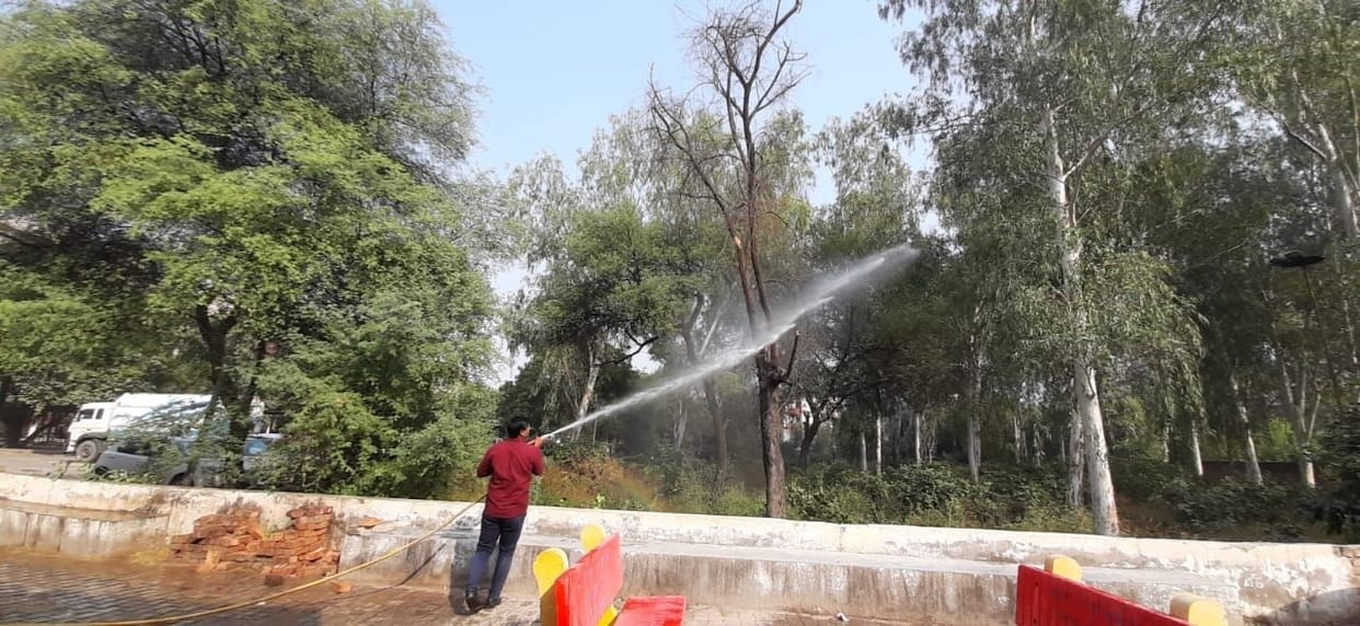 Water sprinkled on trees to improve pollution level