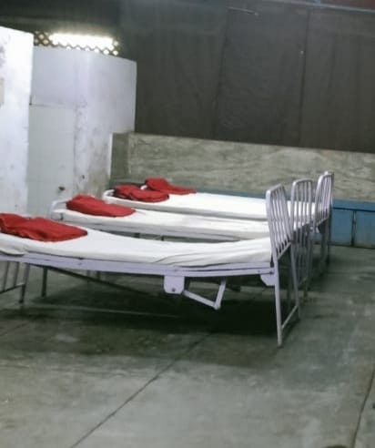 Beds made in night shelters, arranged lighting