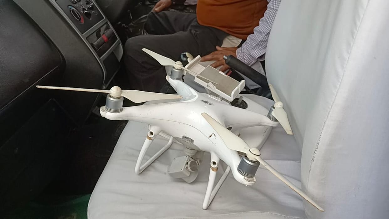 Drone camera flying at the time of helicopter landing, police are interrogating