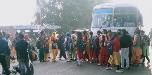 Disturbed by not getting a place in the bus, the girls expressed their anger by standing in front of the bus.