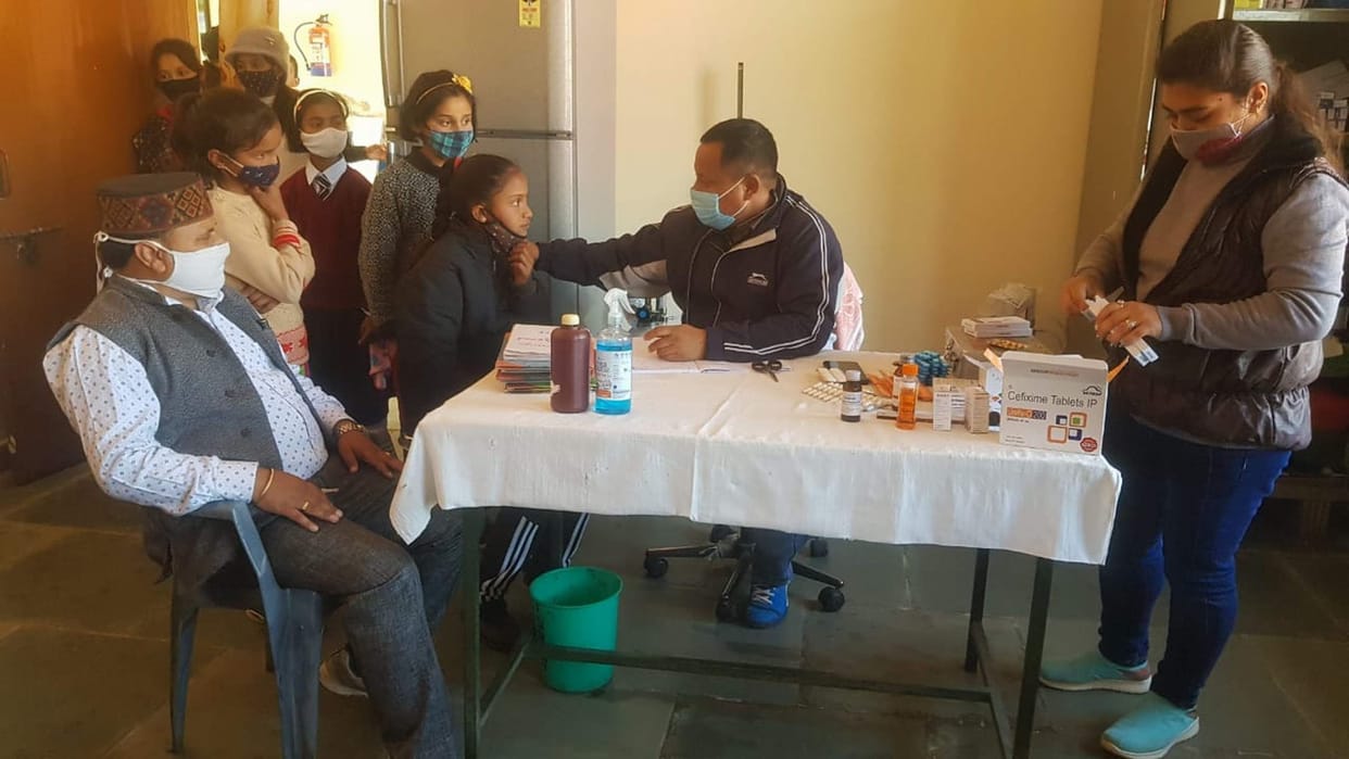 Health team distributed medicine after examining girl students