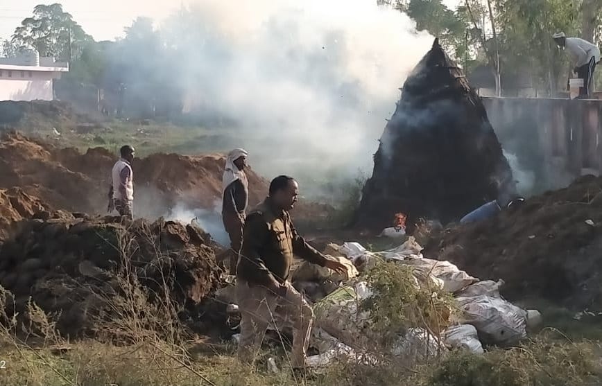 Watchman scorched by fire while destroying seized liquor