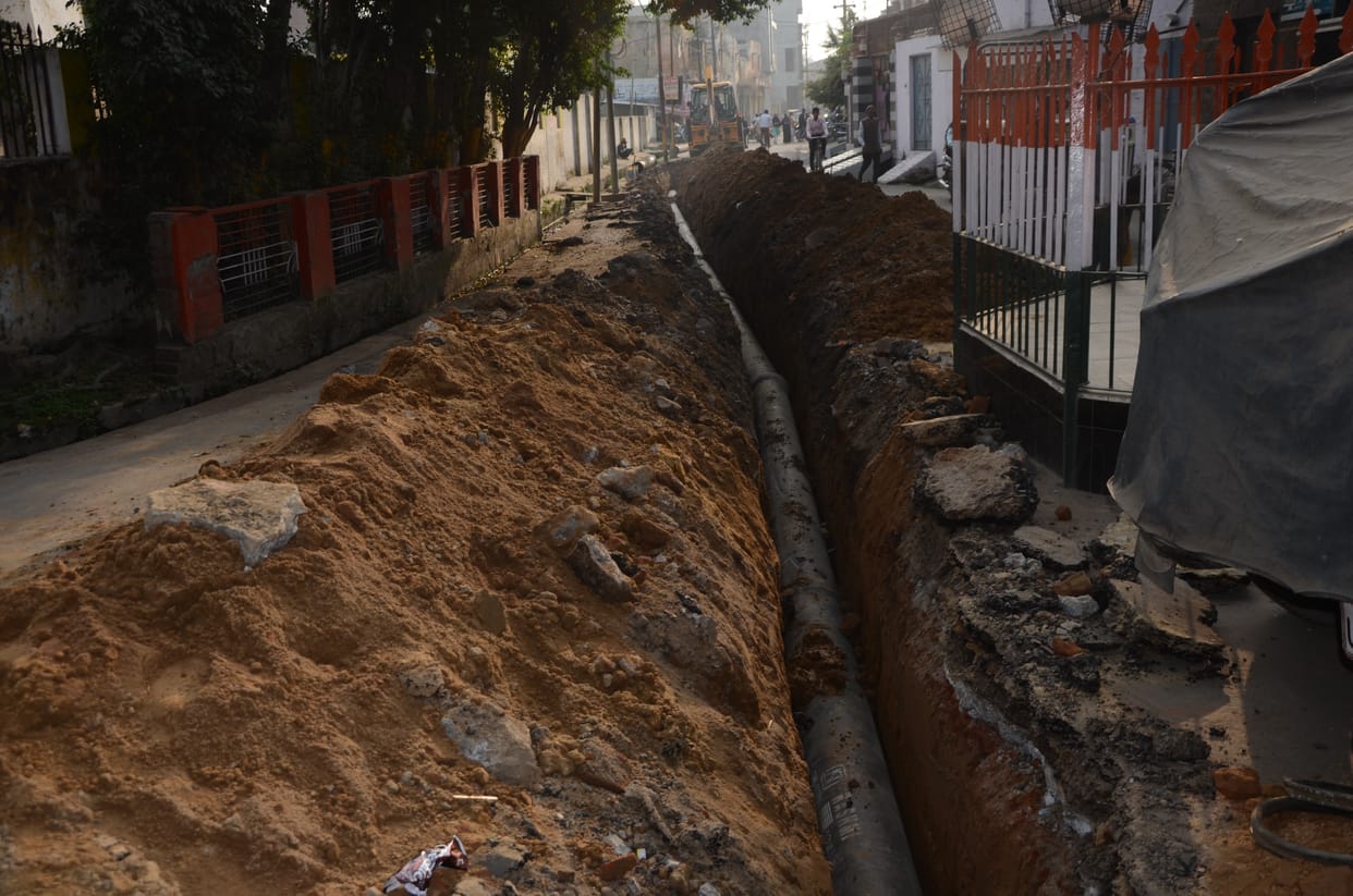 Pedestrians find it difficult to walk due to dug roads, soil