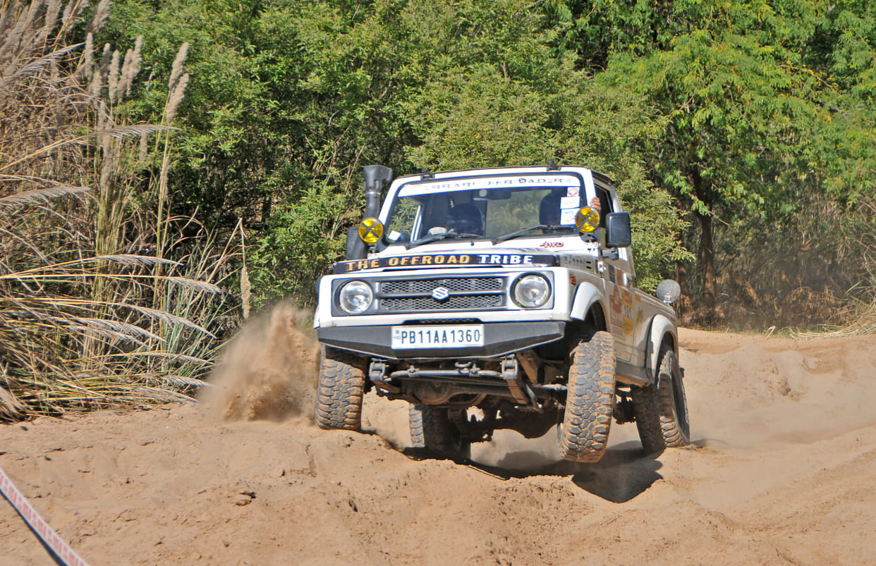 Motor sports stalwarts show courage on sandy, mud and river cross