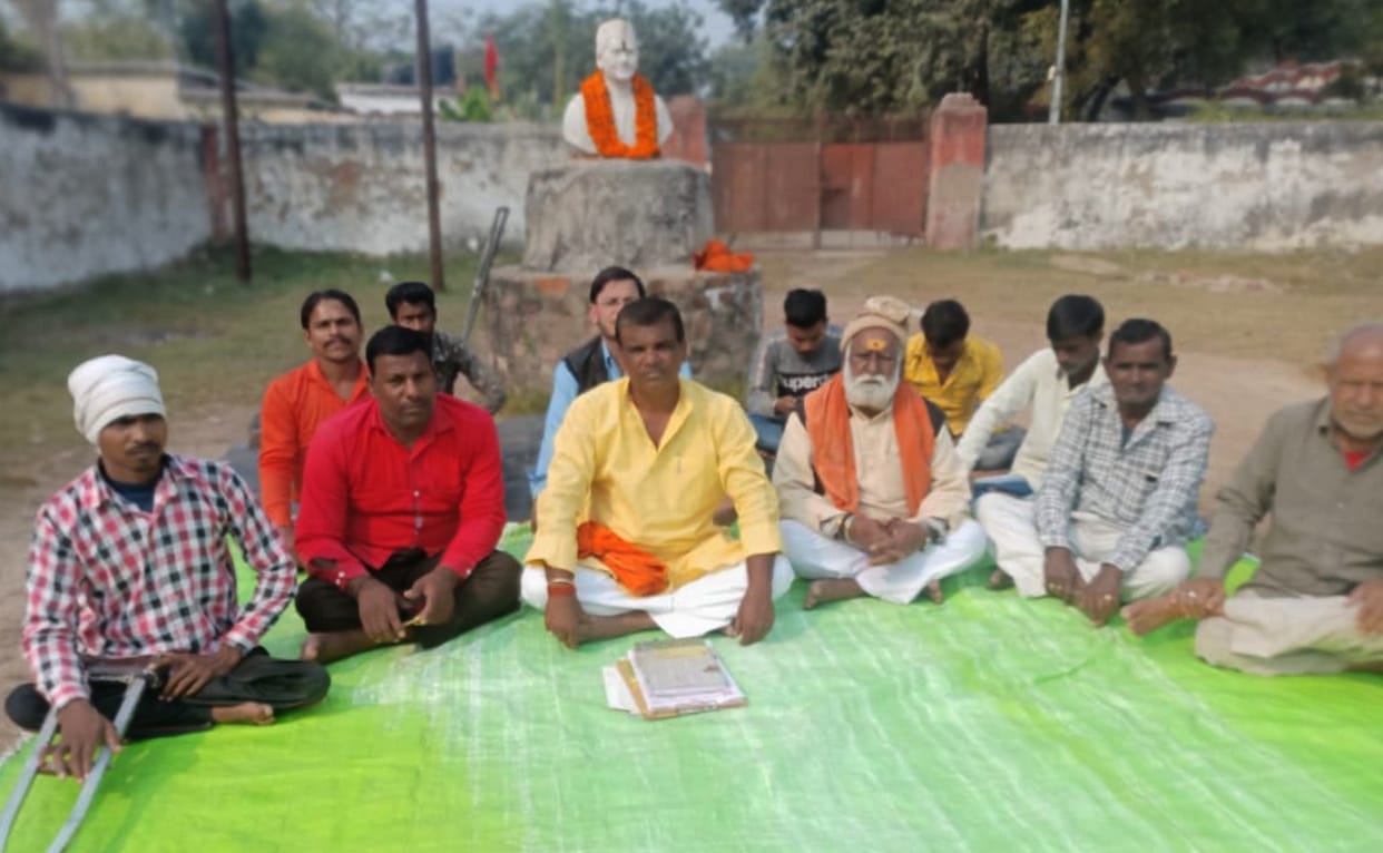 Members of the trust sitting on dharna for the development of the place of birth