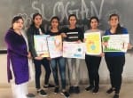 पानीपत। स्लोगन राइटिंग प्रतियोगिता में बनाई गए पोस्टर को दिखाते हुए।