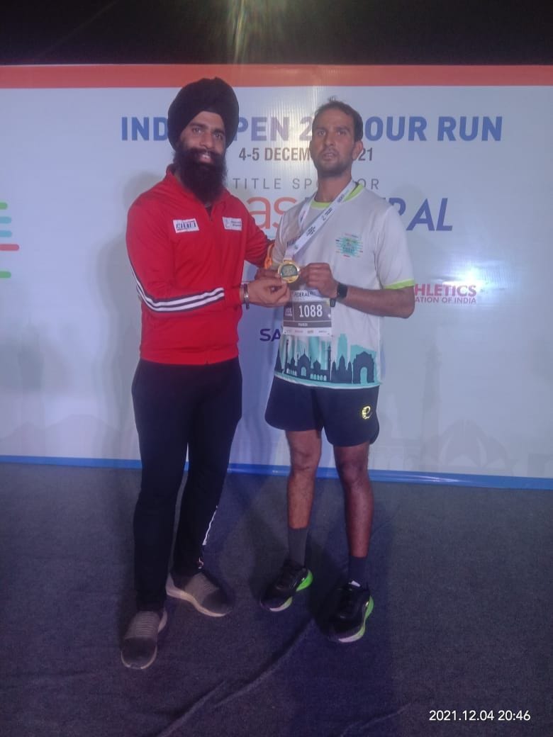 Won gold by running 100 km twelve and a half hours before the scheduled time