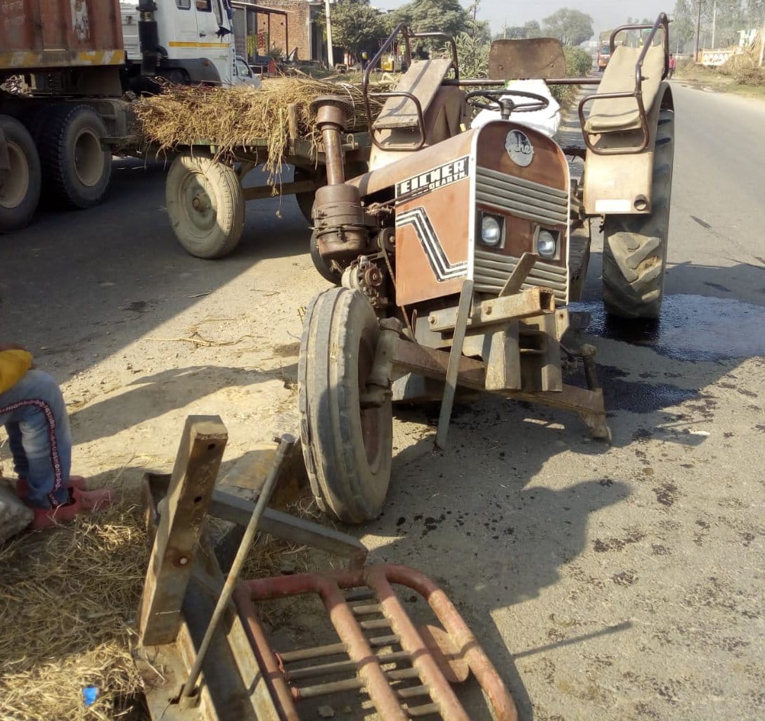Both vehicles damaged in car and tractor collision