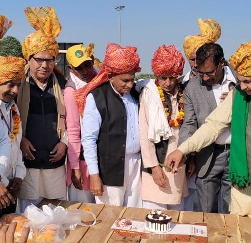 Celebrating victory by cutting cake, singing patriotic songs
