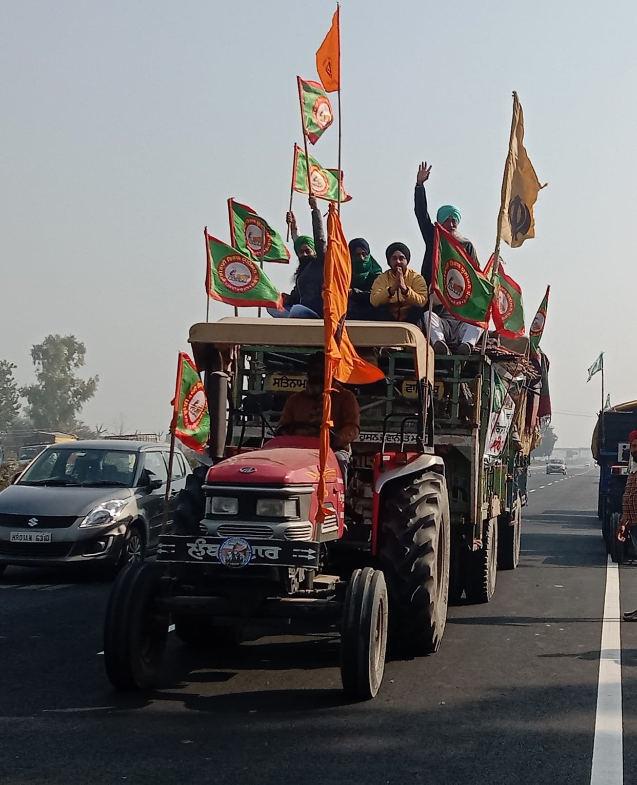 Farmers returned with grills, fans and other items in tractors