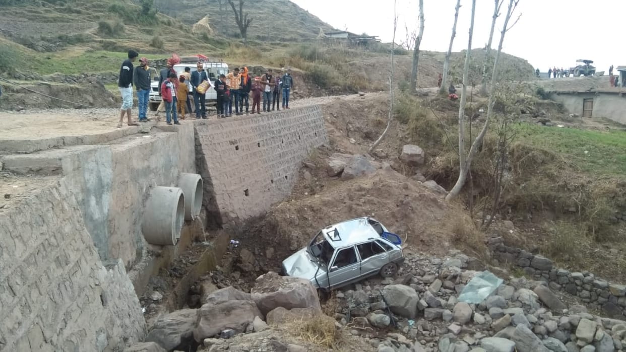 car in the drain twenty feet below