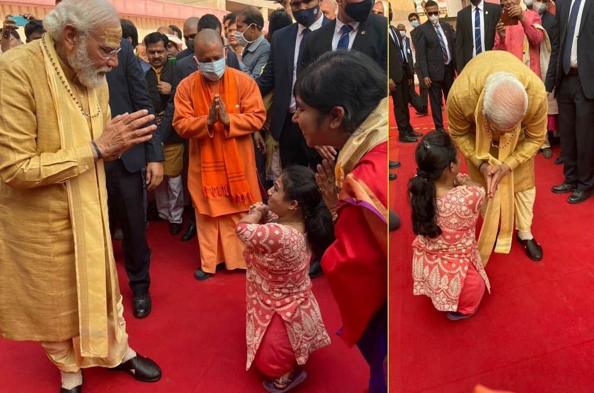 PM Modi touched feet of disabled woman in Kashi Vishwanath Dham pirtures gone viral of Unforgettable moment