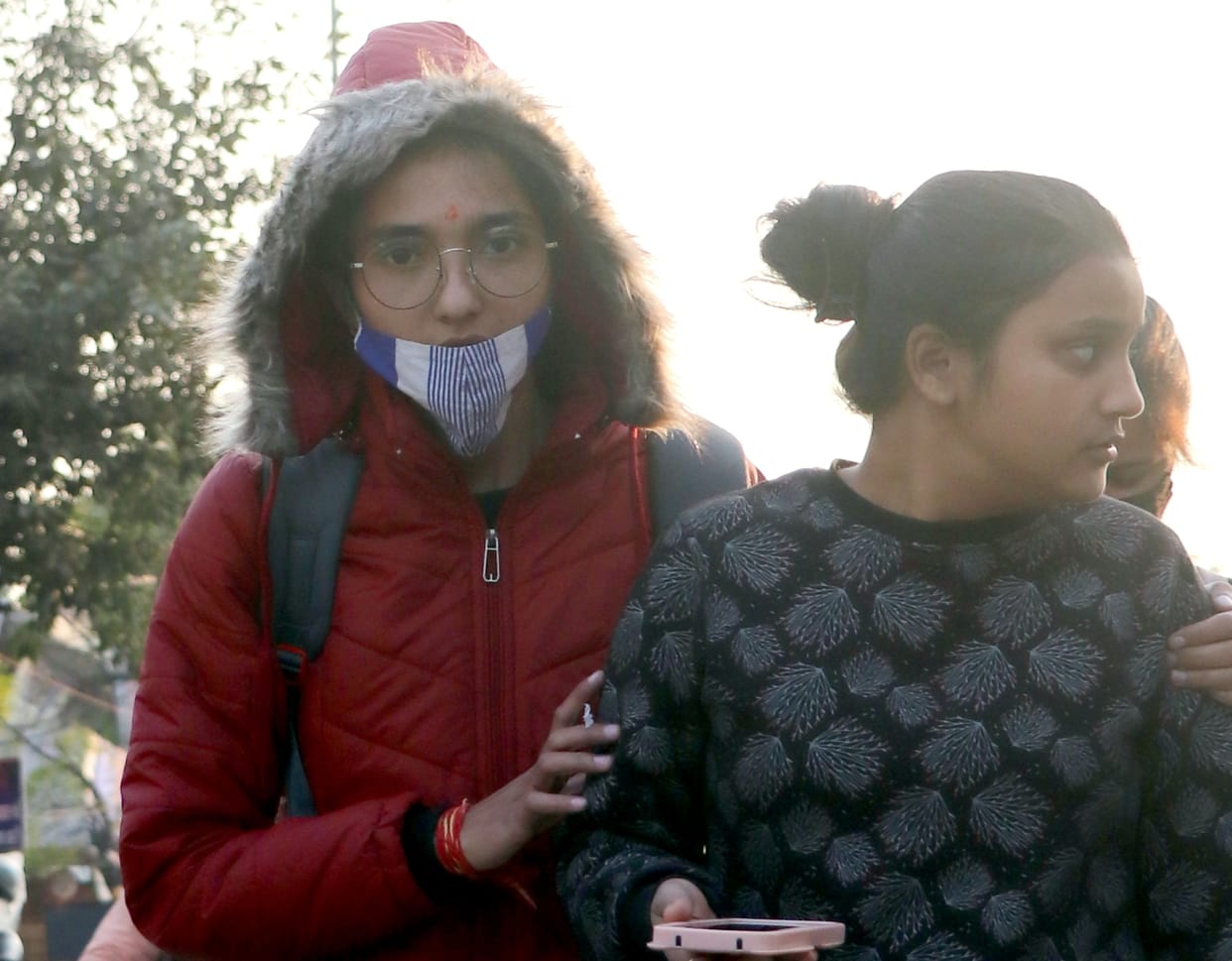 People shivering due to cold wave in the district