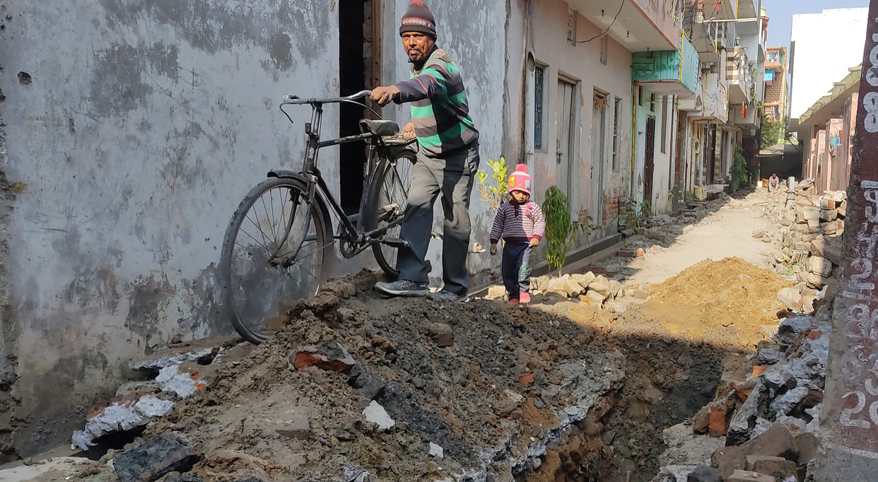 Roads dug for sewer lines, people imprisoned in homes