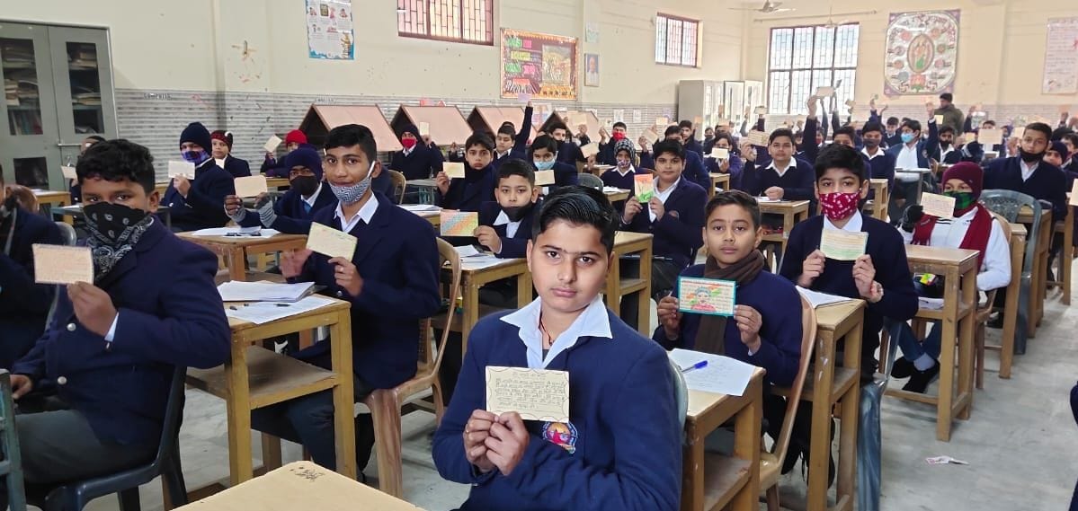 Students write their feelings in postcards