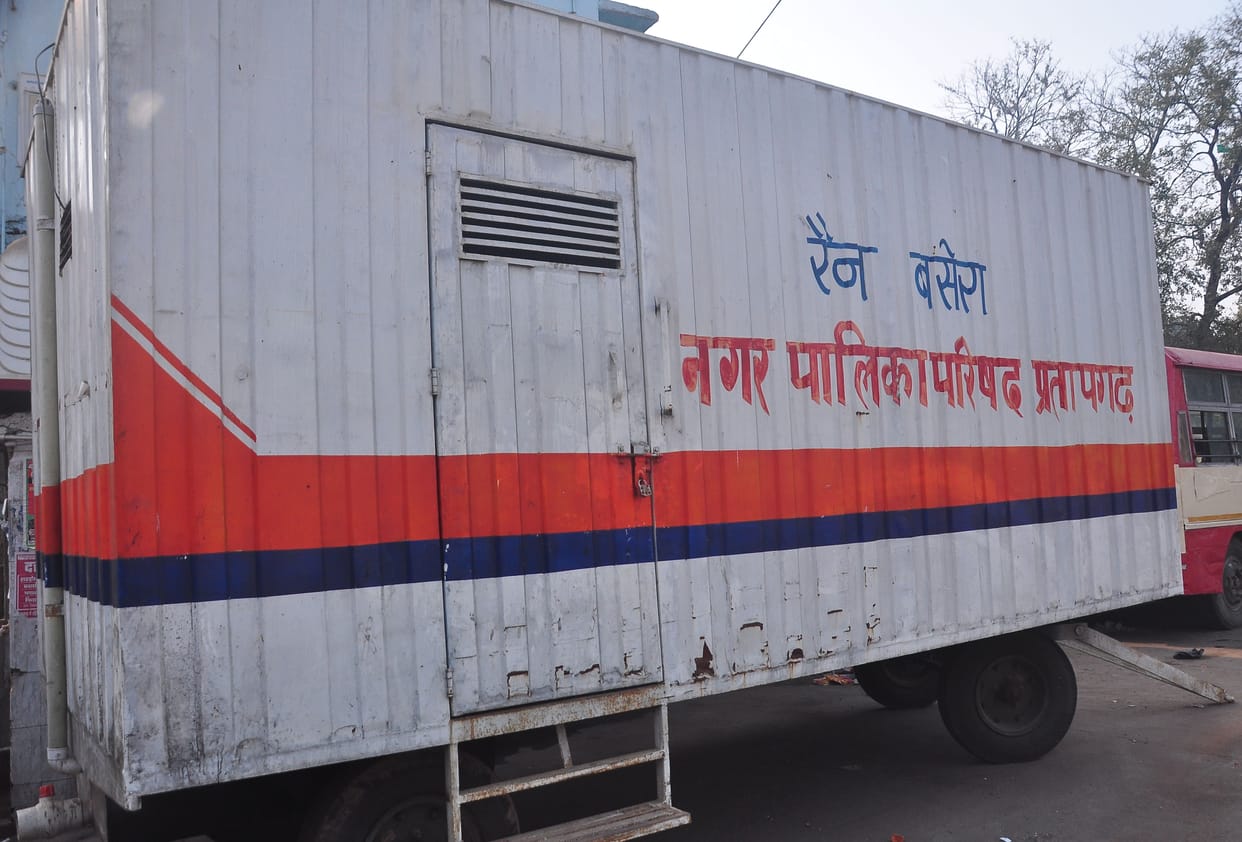 The passengers kept trembling with cold, the lock kept hanging in the bus stand's Rain Basera