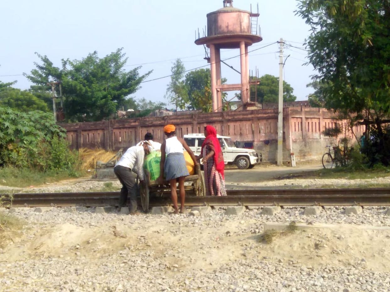 People traveling through the track risking their lives