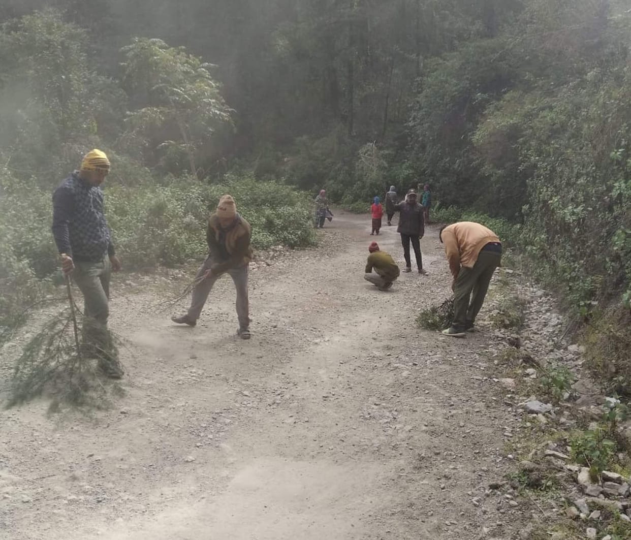 Villagers cleaned the road by doing shramdaan