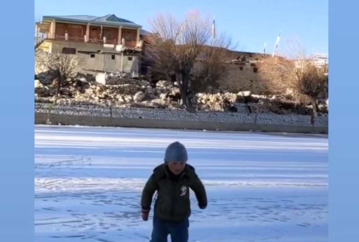 Nako lake frozen in cold winter, children started playing football