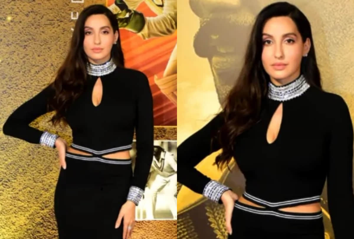 nora fatehi flaunts curvy figure in silver midi dress