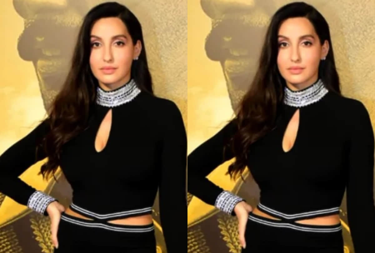 nora fatehi in black cut out dress show curvy figure fit for new year eve party