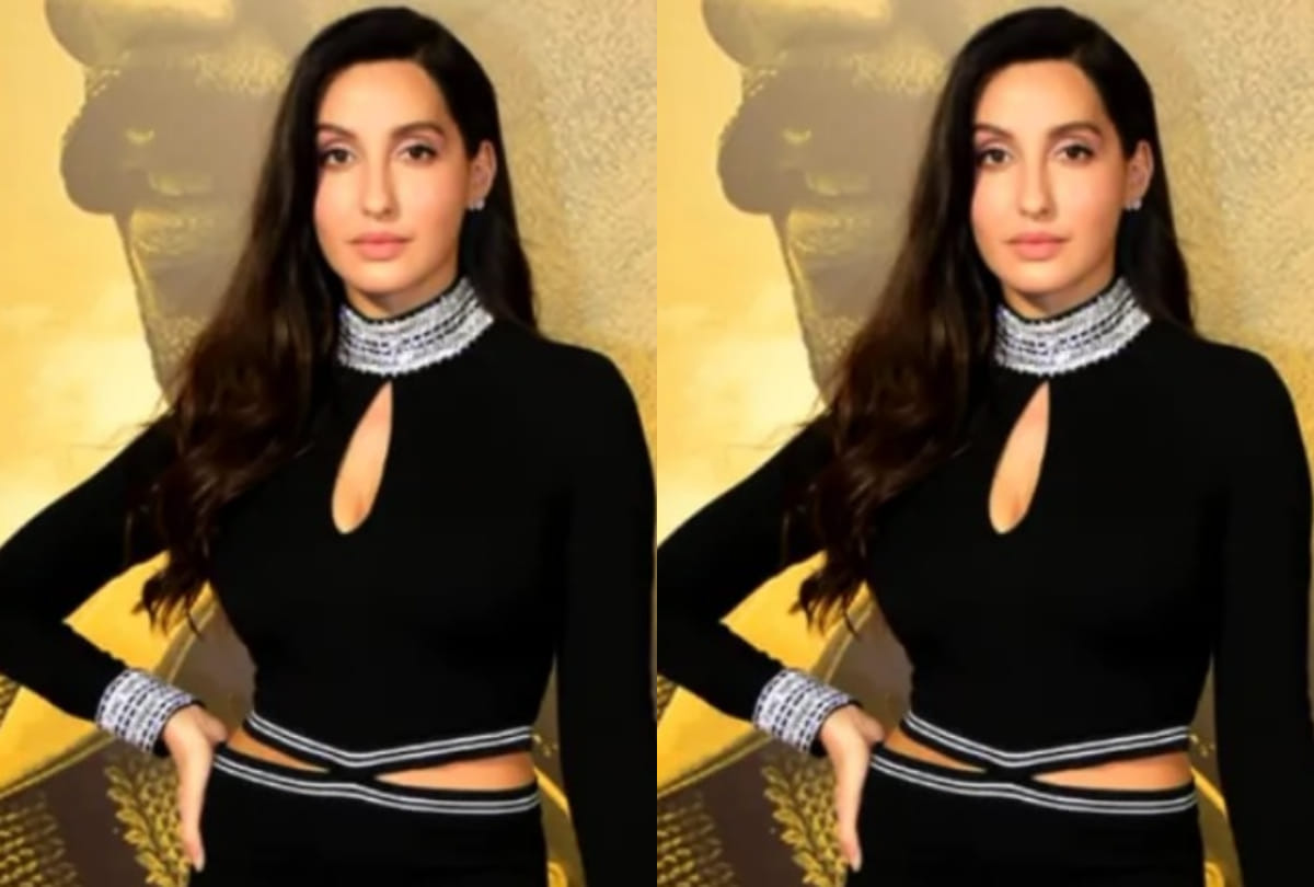 nora fatehi in black cut out dress show curvy figure fit for new year eve party
