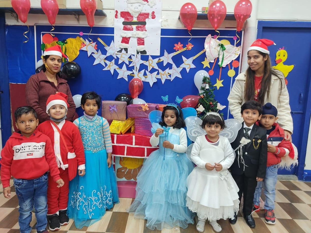 Little Millennium Kids disguised as Santa Claus