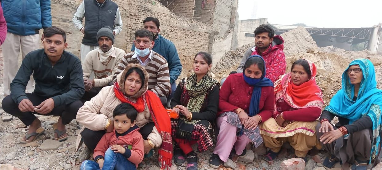 Demonstration outside broken houses