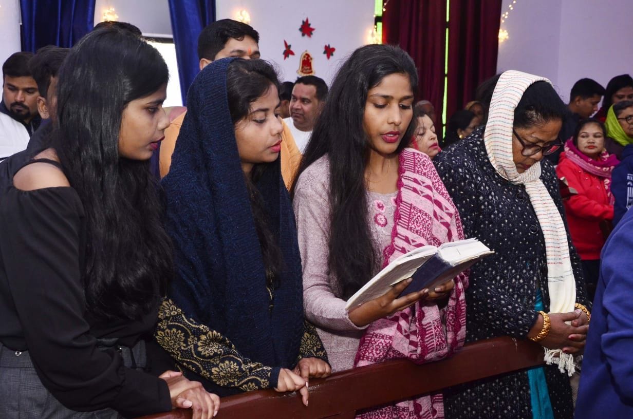 Christmas celebrations, greeted by hugging in churches