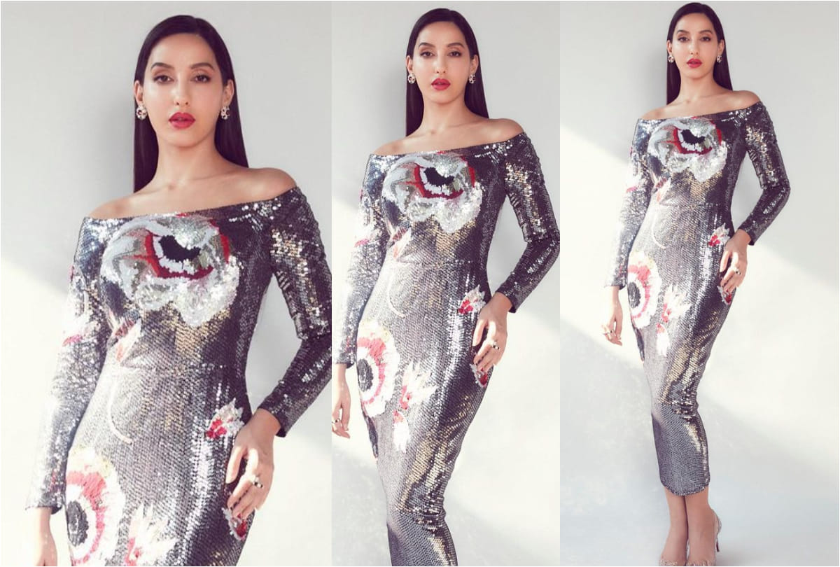 nora fatehi flaunts curvy figure in silver midi dress