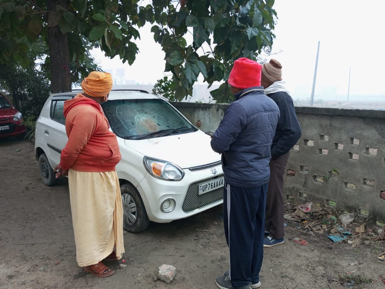 The youths rained sticks on the car parked a few steps away from the outpost