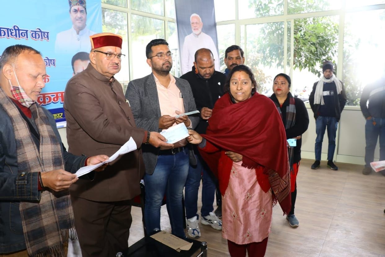 Cabinet Minister Joshi distributed checks of financial assistance