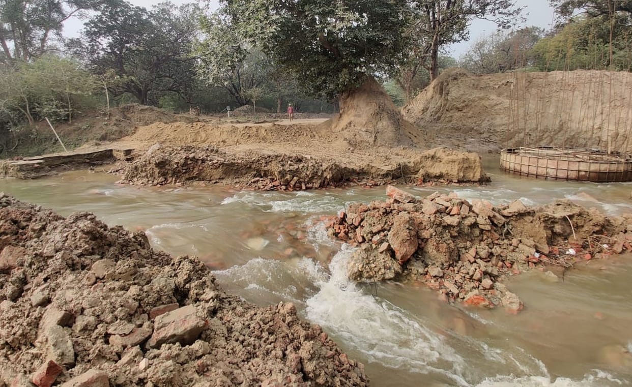 The dam built on the river got washed away in the strong flow of water