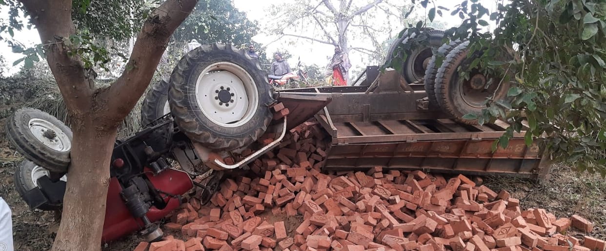 Brick laden tractor overturns, four people injured