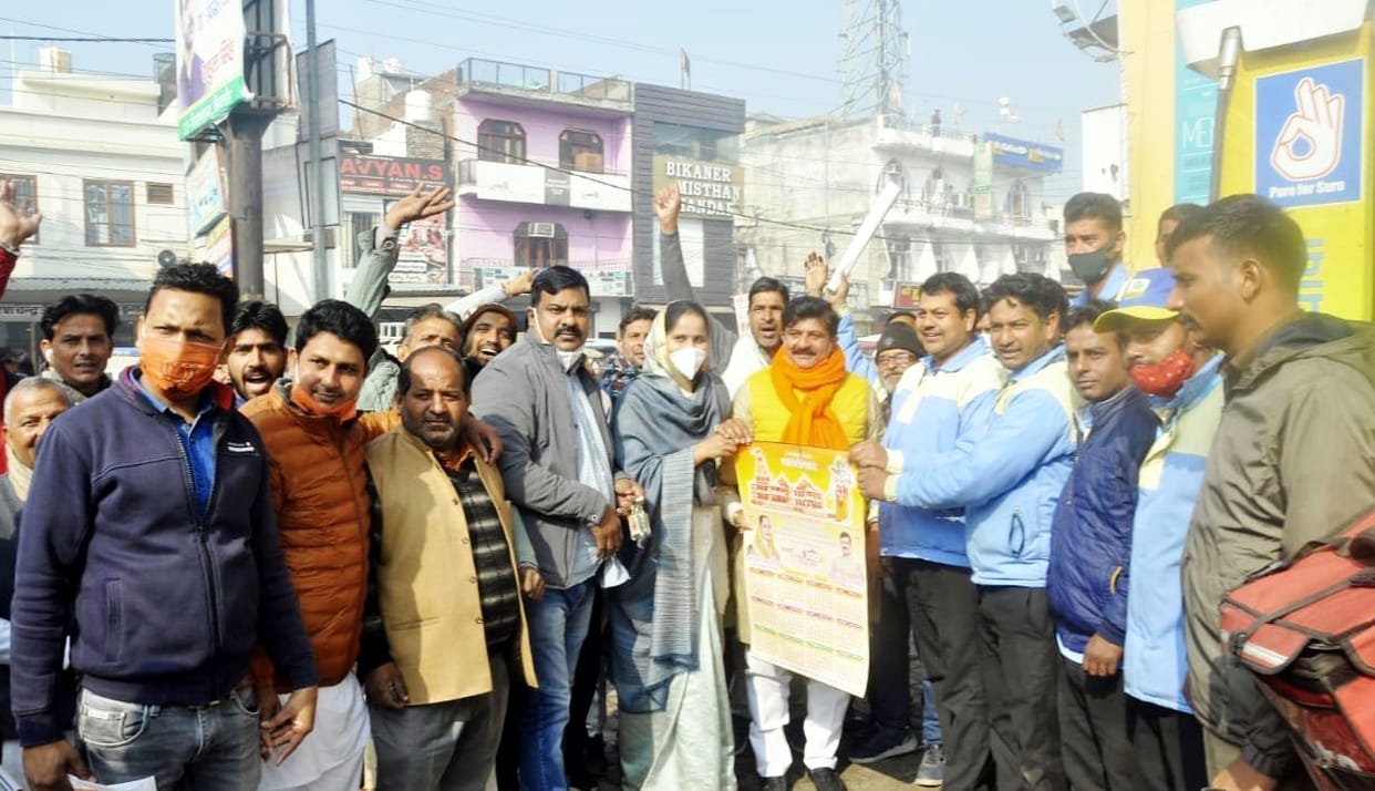 Sadar MLA distributed calendar by visiting the city
