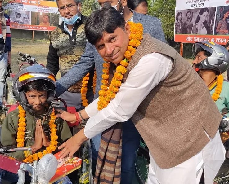 Motorized tricycle presented to 59 differently abled