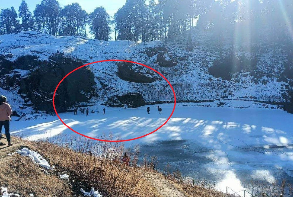 tourist walking on frozen saryolsar lake  kullu himachal pradesh