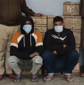 Two smugglers carrying 33 boxes of liquor in Bolero car arrested