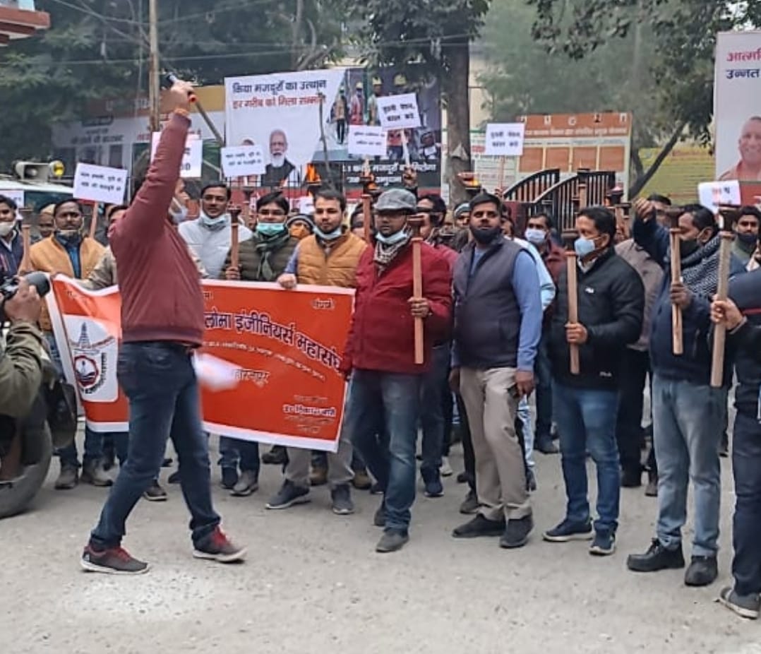 Taking out torch procession demanding restoration of old pension