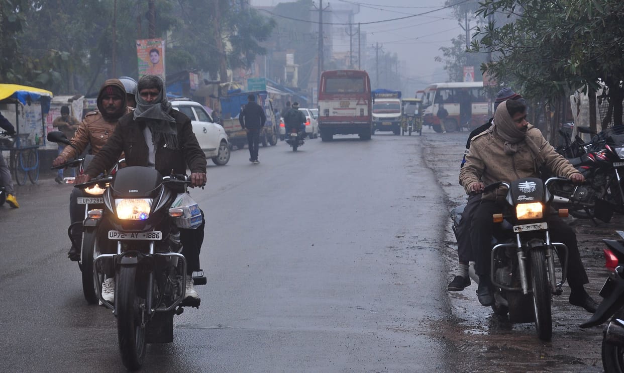 Drizzle rain throughout the day, people shivering due to cold wave