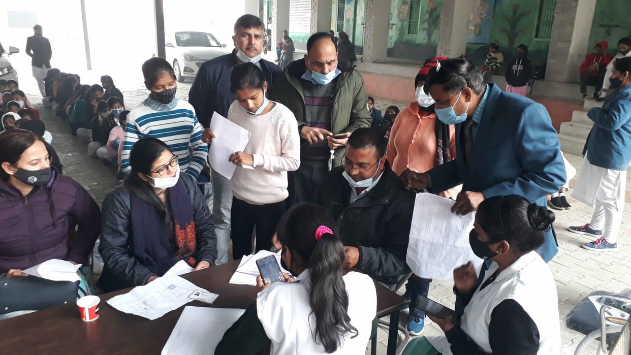 Crowd gathered for vaccination in civil hospital, three counters set up for registration