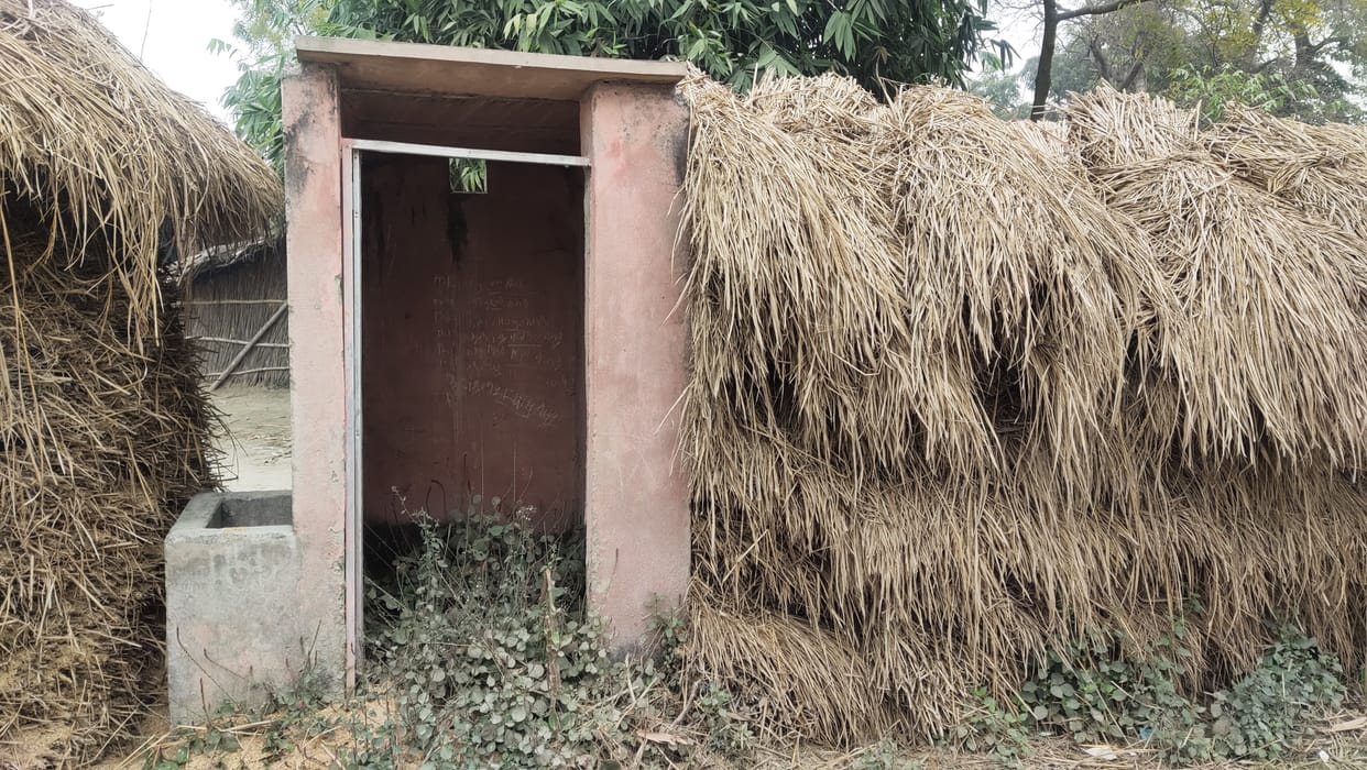Somewhere, the wood is kept, and the toilet is half-completed somewhere.